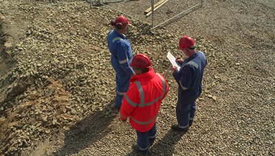Site personnel checking plans